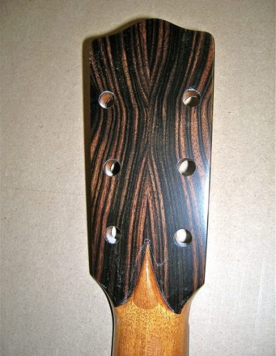 Bookmatched Ebony Laminate on back of Guitar Headstock