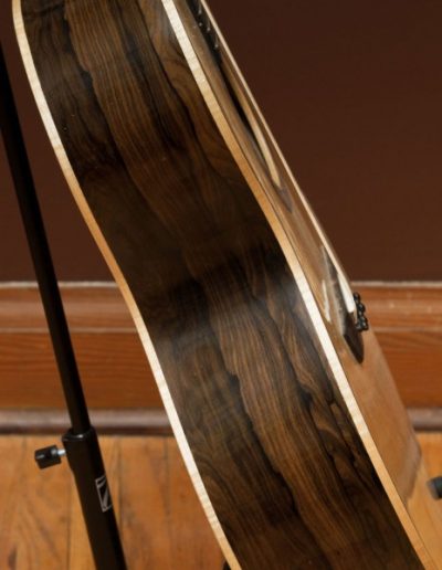 Ziricote Guitar – Side View with Curly Maple Binding